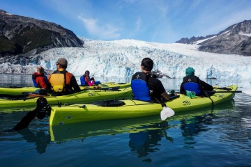 Paddlers relaxing in front of Aialik Glacier